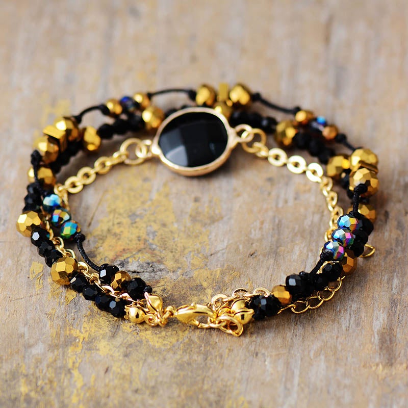 Bracelet en Perles Dorées Halo Positive en Onyx Noir