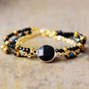 Bracelet en Perles Dorées Halo Positive en Onyx Noir